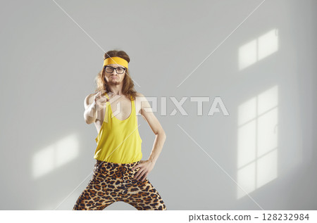 Fitness instructor in funny activewear pointing at camera with angry face expression Fitness instructor in funny activewear pointing at camera with angry face expression 128232984