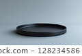 black round black plate on white background 128234586