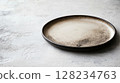 empty plate on concrete background 128234763