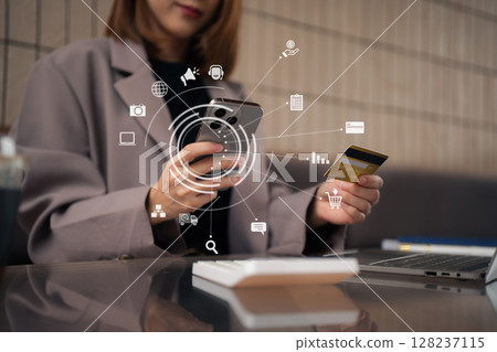 businesswoman use credit cards to conduct financial transactions through phones and laptop. 128237115