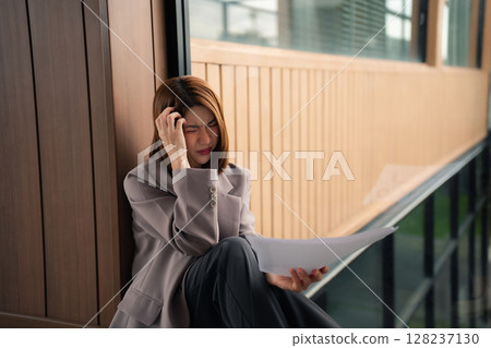 Stress businesswoman under stress from working. Stress businesswoman under stress from working. 128237130