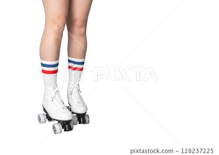 Female teen wearing striped socks and roller skates against white background Female teen wearing striped socks and roller skates against white background 128237225