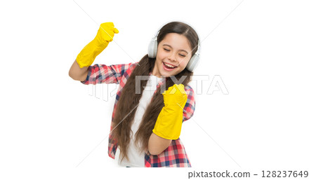 Cleaning supplies. small girl earphones in yellow rubber gloves. happy cleaning sunday. listen music while housekeeping. Make household more joyful. child having fun. Cleaning worries away 128237649