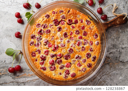 Cherry clafoutis is the taste of summer, fruity and generous close-up in a baking dish. Horizontal top view Cherry clafoutis is the taste of summer, fruity and generous close-up in a baking dish. Horizontal top view 128238867