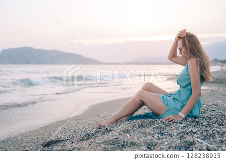 Woman in Flowing Dress on Seaside Pier 128238915