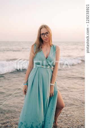 Woman in Flowing Dress on Seaside Pier Woman in Flowing Dress on Seaside Pier 128238921