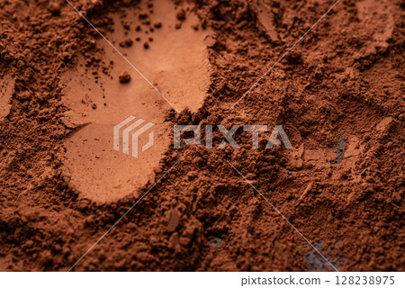 Cocoa powder chocolate texture background 128238975