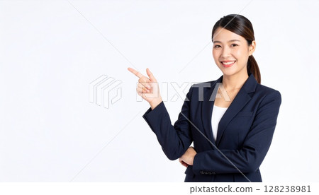 A young woman pointing at a text space. Image of a business scene for recruitment or guidance. 128238981