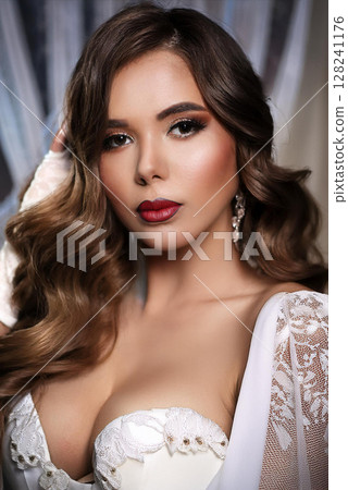Elegant Woman in Silk Camisole and Gloves 128241176