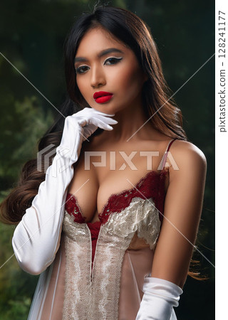 Elegant Woman in Silk Camisole and Gloves 128241177