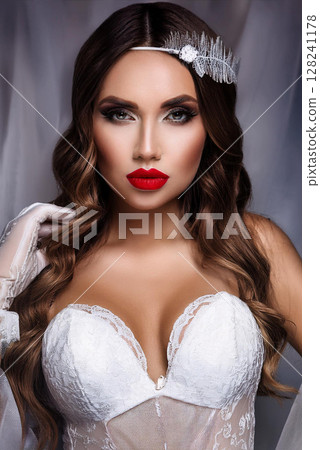 Elegant Woman in Silk Camisole and Gloves 128241178