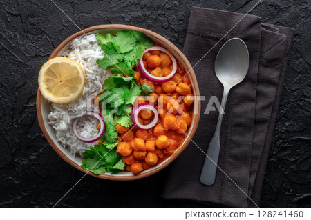 Chana masala, chickpea curry, traditional Indian dish, overhead flat lay shot 128241460