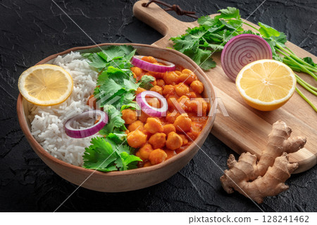 Chana masala, chickpea curry, traditional Indian dish, with fresh ingredients Chana masala, chickpea curry, traditional Indian dish, with fresh ingredients 128241462