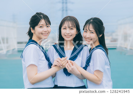 Three high school girls on the roof 128241945