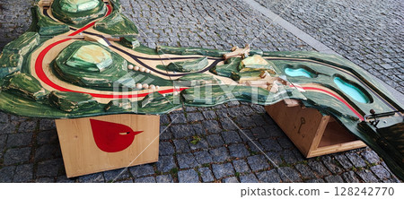 Colorful Wooden Playground Stepping Blocks on Cobblestone Street. Urban Outdoor Kids Game. Concept of child development, learning, in urban living conditions Colorful Wooden Playground Stepping Blocks on Cobblestone Street. Urban Outdoor Kids Game. Concept of child development, learning, in urban living conditions 128242770