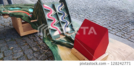 Colorful Wooden Playground Stepping Blocks on Cobblestone Street. Urban Outdoor Kids Game. Concept of child development, learning, in urban living conditions 128242771
