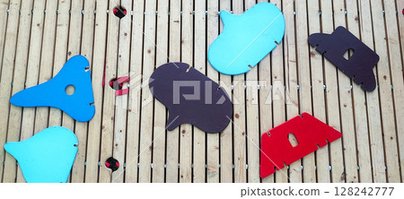 Colorful Wooden Playground Stepping Blocks on Cobblestone Street. Urban Outdoor Kids Game. Concept of child development, learning, in urban living conditions Colorful Wooden Playground Stepping Blocks on Cobblestone Street. Urban Outdoor Kids Game. Concept of child development, learning, in urban living conditions 128242777