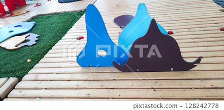 Colorful Wooden Playground Stepping Blocks on Cobblestone Street. Urban Outdoor Kids Game. Concept of child development, learning, in urban living conditions Colorful Wooden Playground Stepping Blocks on Cobblestone Street. Urban Outdoor Kids Game. Concept of child development, learning, in urban living conditions 128242778