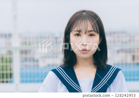 high school girl standing on the roof 128242953