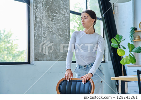 Portrait of beautiful stylish young teenage girl posing at home Portrait of beautiful stylish young teenage girl posing at home 128243261