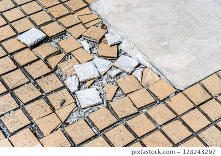 Outdoor passage: Damaged tile 128243297