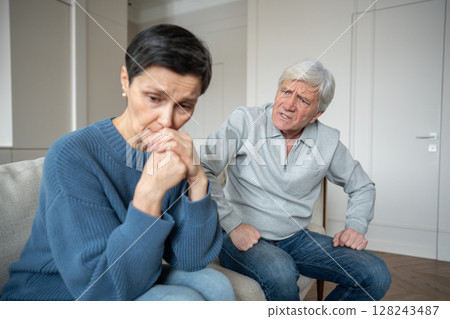 Furious senior man show verbal abuse toward wife in quiet and emotionally withdrawn at home Furious senior man show verbal abuse toward wife in quiet and emotionally withdrawn at home 128243487