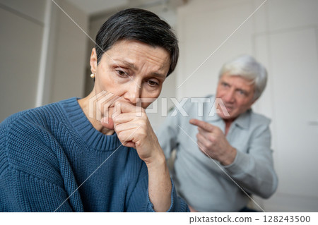 Shocked sad frightened mature woman feeling wronged by hysterical husband outburst. Emotional trauma Shocked sad frightened mature woman feeling wronged by hysterical husband outburst. Emotional trauma 128243500