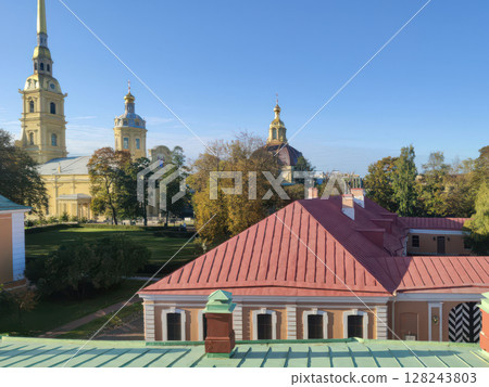 View of the roofs of St. Petersburg and the domes of churches. Horizontal photo, sunny autumn day. View of the roofs of St. Petersburg and the domes of churches. Horizontal photo, sunny autumn day. 128243803