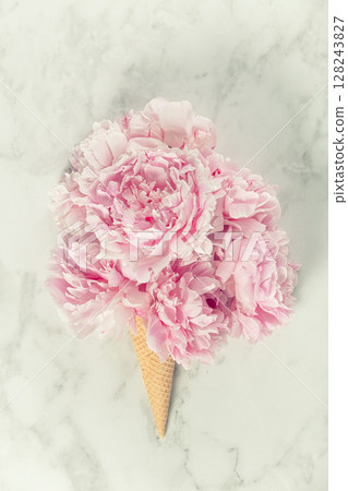 Pink Peony Bouquet in Ice Cream Cone on Marble Surface Pink Peony Bouquet in Ice Cream Cone on Marble Surface 128243827