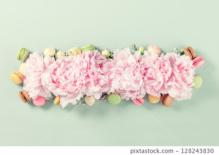 Pink Peonies with Colorful Macarons on Green Background 128243830