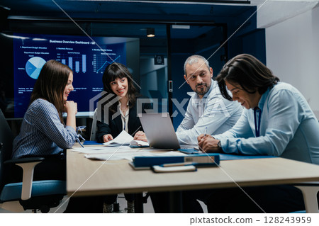 Business executives and assistants brainstorming investment risk evaluation in corporate boardroom Business executives and assistants brainstorming investment risk evaluation in corporate boardroom 128243959