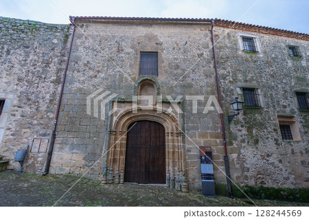Historic Monastery Entrance in Trujillo Spain with Stone Archway. 128244569