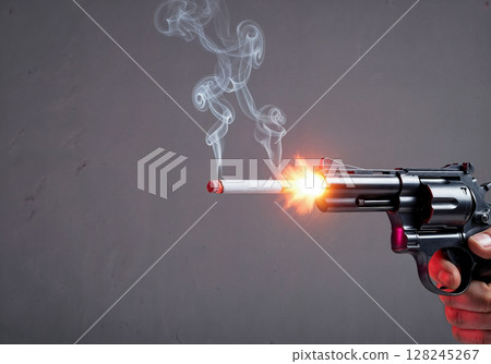 Smoking gun with cigarette barrel firing with smoke and flame, concept of danger and addiction in dramatic close up image 128245267