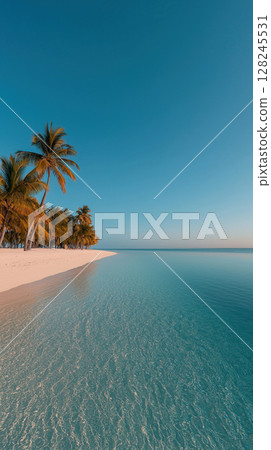 A serene beach scene with clear water and palm trees under a bright blue sky. 128245531