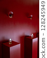An Elegant Perfume Display Presenting on a Rich and Vibrant Red Background, Captivating All 128245949