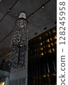 An Elegant Chandelier Enhances Modern Architecture, Adding Chic Ambiance and Style 128245958
