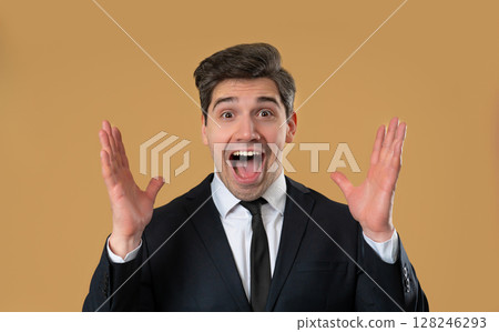 Handsome mature businessman reacts with amazed expression, says wow, open mouth 128246293
