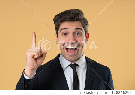Genius Idea. Resourceful 30S Aged Businessman.eureka Moment,Pointing Finger Up Genius Idea. Resourceful 30S Aged Businessman.eureka Moment,Pointing Finger Up 128246295