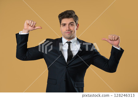 Smug businessman confidently pointing at himself with proud facial expression Smug businessman confidently pointing at himself with proud facial expression 128246313
