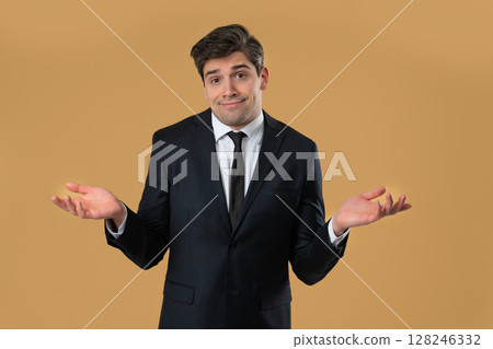 Businessman shrugs shoulders showing uncertainty, confusion, dilemma, hesitation 128246332