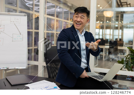 Young asian businessman working on a laptop in his office 128246774