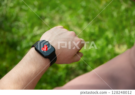 Smart watch on hands of athlete for sports workout, heartbeat info or fitness progress on app. Personal trainer, exercise or closeup of person with timer to check or monitor gym data. Outdoors 128248012