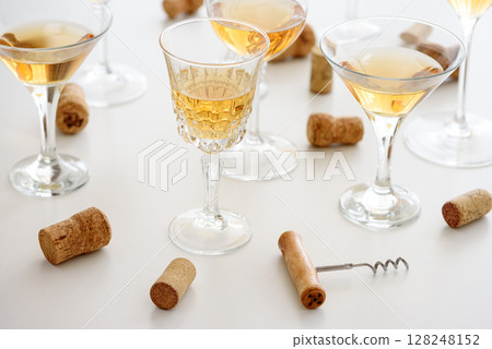 Set of glasses of yellow wine at wine tasting Set of glasses of yellow wine at wine tasting 128248152