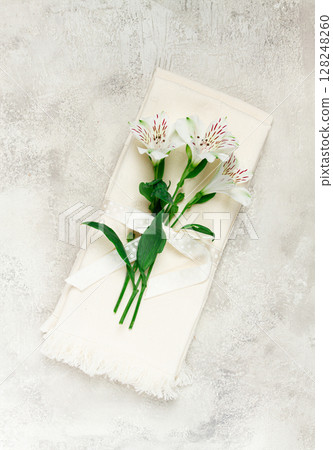 kitchen towels, cream color, with alstroemeria, Peruvian lily, top view, concept, decor, no people, kitchen towels, cream color, with alstroemeria, Peruvian lily, top view, concept, decor, no people, 128248260