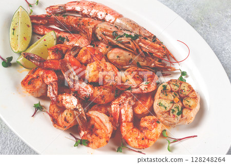 fried langoustines and tiger shrimps, with spices and herbs, homemade dish, without people, 128248264