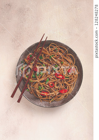 udon noodles, with shimeji mushrooms, vegetables, in sauce, with sesame seeds, green onions, Asian vegetarian food, horizontal, without people, 128248278