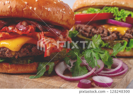 two burgers with beef patty, fried bacon, cheddar cheese, tomatoes, homemade, no people, two burgers with beef patty, fried bacon, cheddar cheese, tomatoes, homemade, no people, 128248300