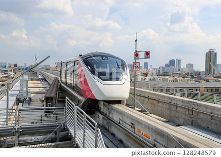 The pink monorail Mass Transit System serving in the Metropolitan Region. 128248579