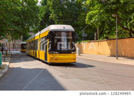 Yellow tram on city street in Berlin Germany Yellow tram on city street in Berlin Germany 128249465