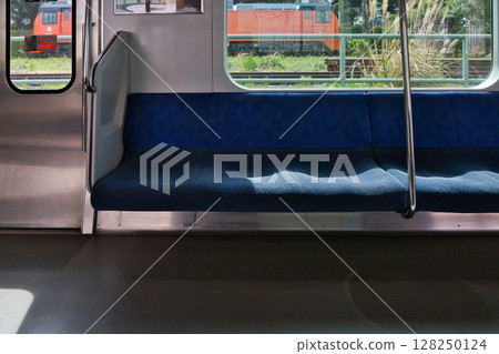 Car seat door Musashino Line 205 series rapid train Kitafuchu Station platform 128250124